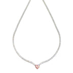 Elegant heart necklace in the tennis style featuring a shimmering chain 
adorned with sparkling zircon stones and a heart-shaped charm, available in pink and yellow tones. 