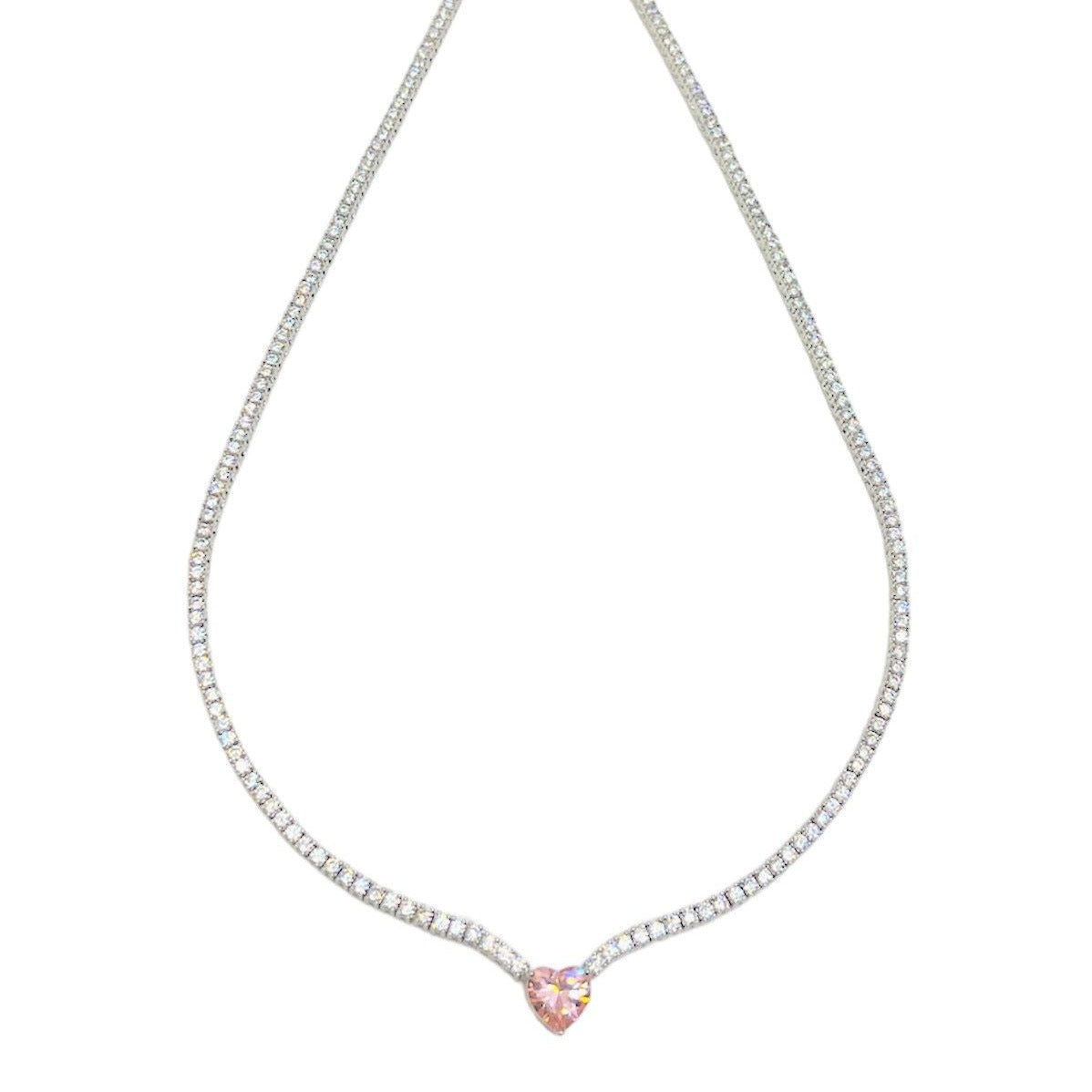 Elegant heart necklace in the tennis style featuring a shimmering chain 
adorned with sparkling zircon stones and a heart-shaped charm, available in pink and yellow tones. 