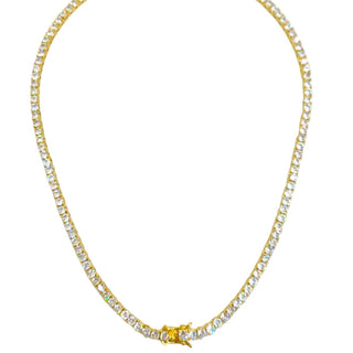 This close-up of a sparkling tennis necklace with shimmering zircon stones, a gold-plated finish, and a sleek 3mm width showcases its radiant elegance and timeless appeal. 
Perfect for both casual and formal occasions, this luxurious piece adds a touch of sophistication to any outfit. 