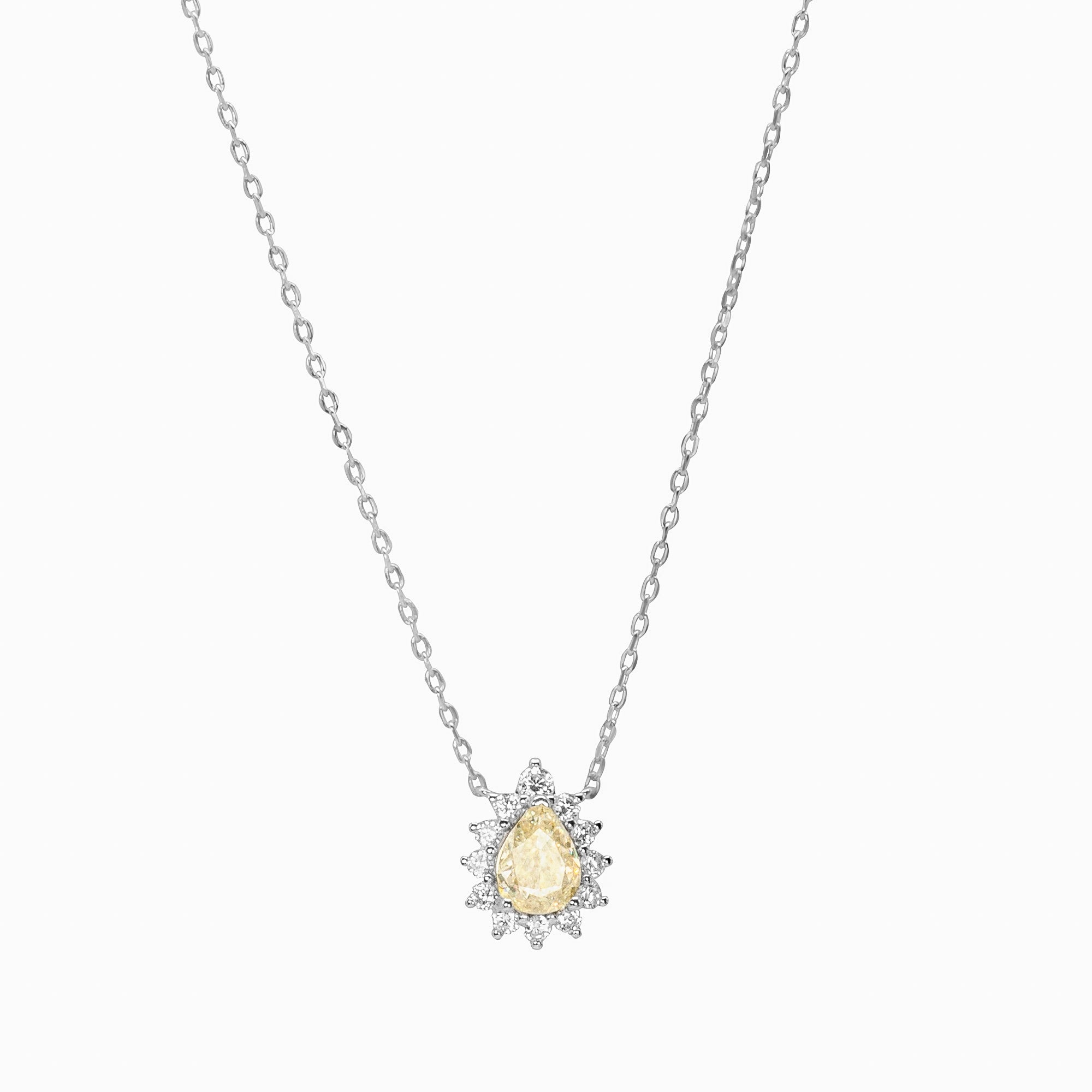 The elegant Reverie Necklace — a sophisticated silver jewelry piece, adorned with sparkling zircon stones and a radiant yellow centrepiece, is perfect for adding timeless charm 
and luxury to your style.