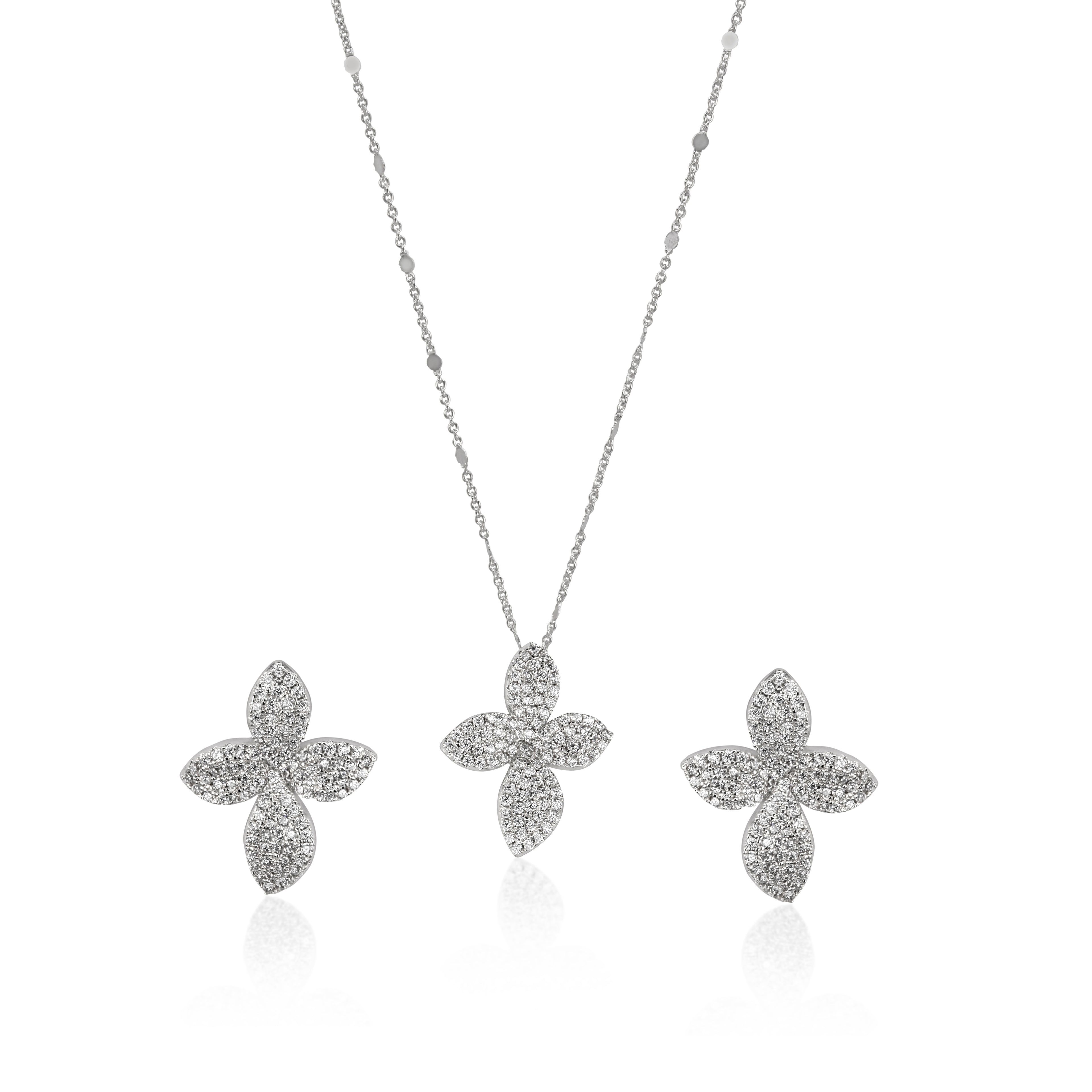 A white gold-plated clover necklace and earrings set with brilliant zircon diamond like from Selsela.
